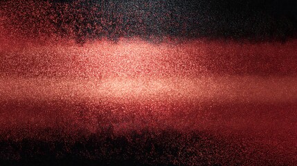 Red glitter particles against a dark background black texture