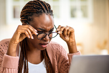 Eyesight Problems. Black Lady In Glasses Squinting While Looking At Laptop Screen, Millennial...