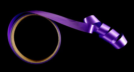 Violet paper ribbon twisted with cardboard roll isolated on black background and texture, top view	
