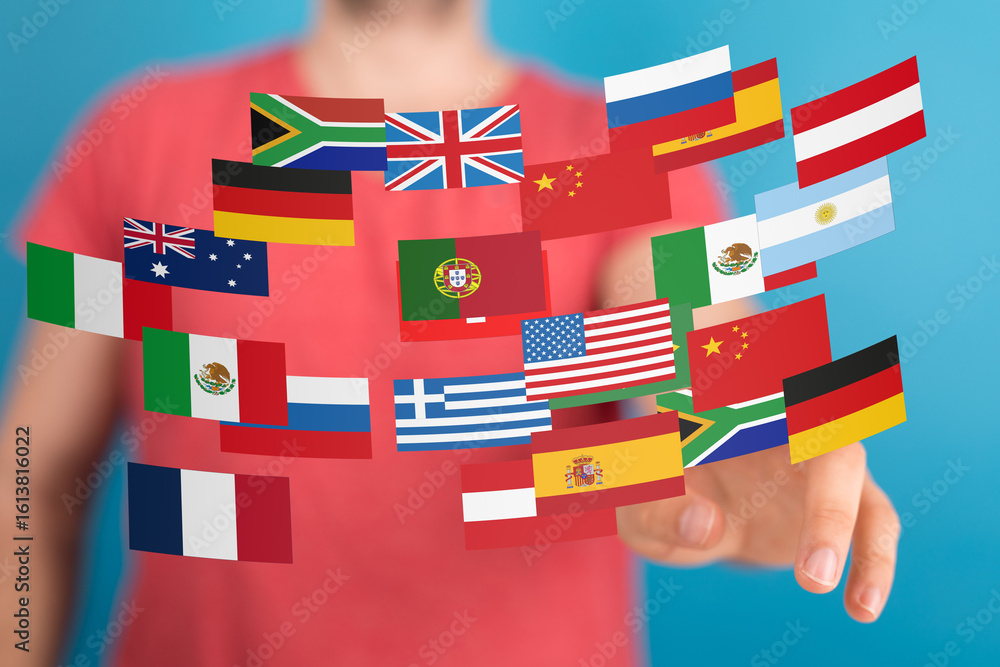 Poster image of a person interacting with a digital display of various national flags, symbolizing global c