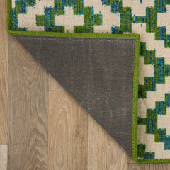 The specially designed carpet was laid on the floor and folded into a square format so that its...