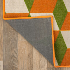 The specially designed carpet was laid on the floor and folded into a square format so that its...