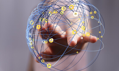 Abstract image depicting a hand interacting with a digital network sphere. Represents connection,...