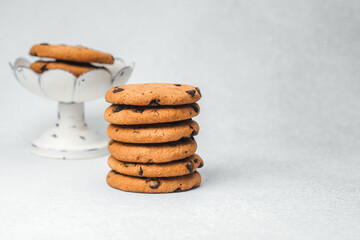 Freshly baked chocolate chip cookies on a display stand