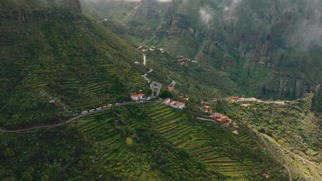Scenic aerial view of Masca village under clouds with sun rays breaking through, Tenerife, Canary Islands