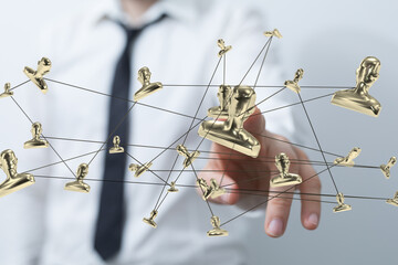Image of a businessman interacting with a network of golden profile icons, symbolizing global...