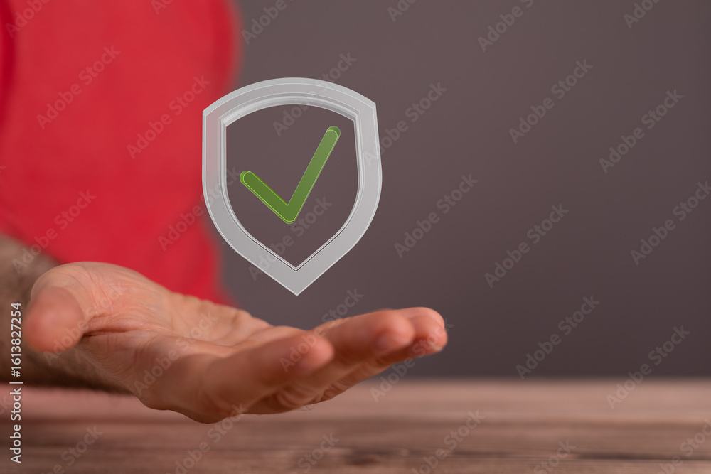 Poster image of a hand holding a digital shield with a checkmark, symbolizing data protection and security.
