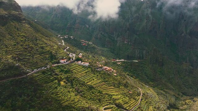 Scenic aerial view of Masca village under clouds with sun rays breaking through, Tenerife, Canary Islands