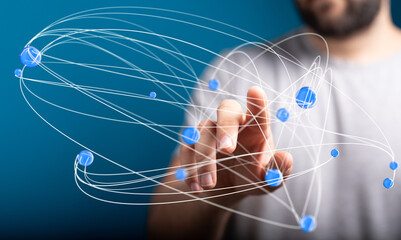 Abstract image depicting a man connecting digital nodes, representing global networks and...