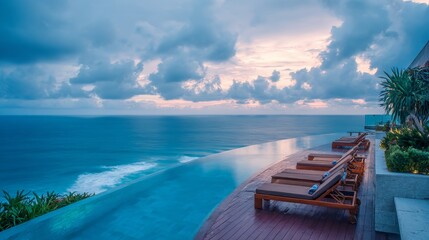Modern tropical mansion with infinity pool facing the ocean, surrounded by lush plants and sun loungers, dramatic cloudy sky at dusk, cinematic perspective with luxurious ambiance and realistic detail
