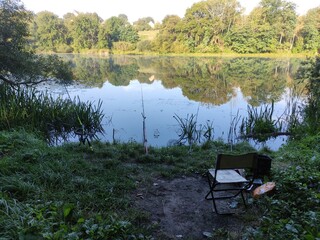 Fototapeta premium Morning Fishing on the Lake: Tranquility and Nature.