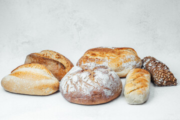 Freshly baked bread assorted on a light background ready for serving