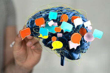 Abstract image of a brain with colorful speech bubbles, representing communication, ideas, and...
