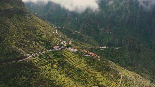 Scenic aerial view of Masca village under clouds with sun rays breaking through, Tenerife, Canary Islands