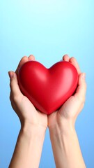 Fototapeta premium Hands holding a red heart