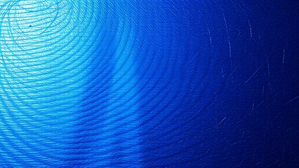A close-up of a textured metallic surface with a subtle blue hue.