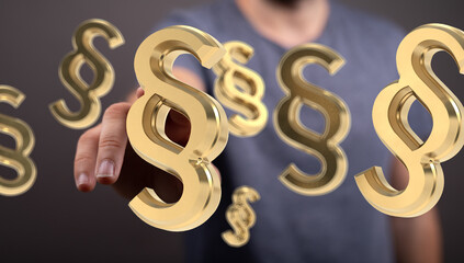 Abstract image of a hand reaching for golden paragraph symbols.  Perfect for legal, law, or...