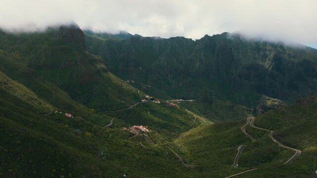 Scenic aerial view of Masca village under clouds with sun rays breaking through, Tenerife, Canary Islands