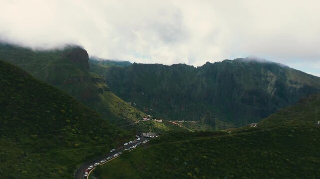 Scenic aerial view of Masca village under clouds with sun rays breaking through, Tenerife, Canary Islands
