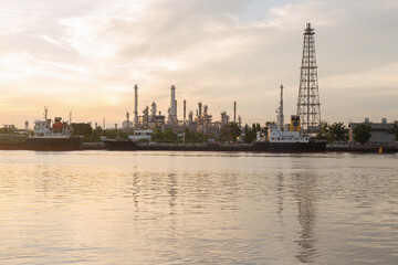 Naklejka premium Oil refinery industry plant at dusk.