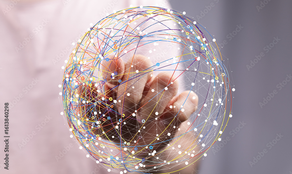 Poster abstract image depicting a hand interacting with a digital sphere, representing global connectivity 