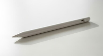 Sleek white stylus pen on a clean white surface with subtle shadow