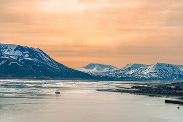 Sailing Boat in Arctic Fjord at Sunset