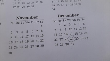 marking the december 24 date on the calendar	
