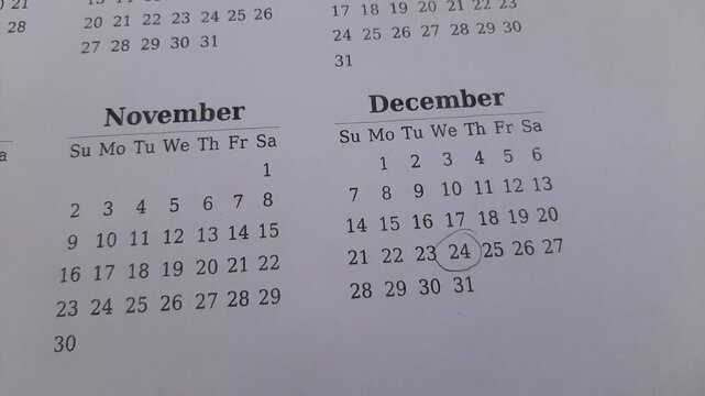 marking the december 24 date on the calendar	
