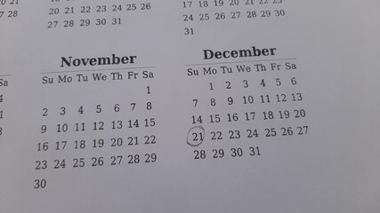 marking the december 21 date on the calendar	
