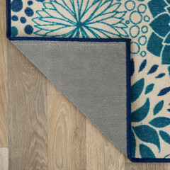 The specially designed carpet was laid on the floor and folded into a square format so that its...
