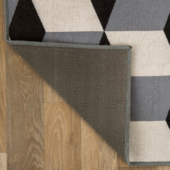 The specially designed carpet was laid on the floor and folded into a square format so that its...