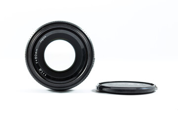 An old manual control camera lens isolated on white.