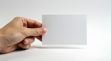 Fototapeta premium White Card Holding in Hand