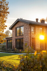 A beautiful modern brick house at sunset, golden hour, cozy lighting, warm tones, large windows reflecting the sun