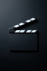 Film clapperboard set against a dark background with its hinged top raised. Concept: Filmmaking, movie production, cinema, directing, video creation
