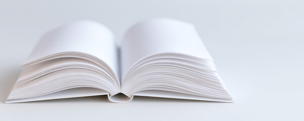 An open book with blank pages lies on a surface, inviting creativity or study. Concept: potential, writing, education