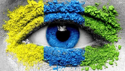 A close-up of an eye with painted Ukrainian colors