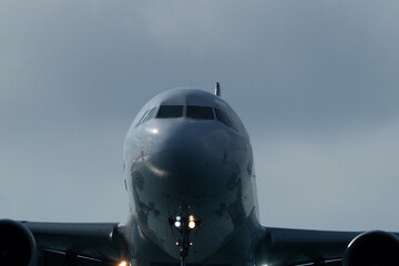 Airplane Nose Close-Up with Cockpit Windows, Close up view of the front of a passenger jet airplane.