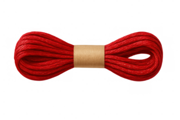 Bright red embroidery thread with paper label, positioned against transparent background, showcasing vivid color and detailed texture