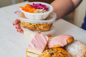 Delicious Assortment of Takeout Food and Desserts Displayed at a Dining Table