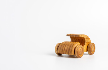 Minimalist handcrafted wooden car toy, retro style on clean white studio background
