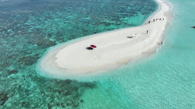 Aerial view of the pristine white sandbank meets the turquoise sea, a scene of serene beauty and tranquility, Thoddoo, Alif Alif Atoll, Maldives.