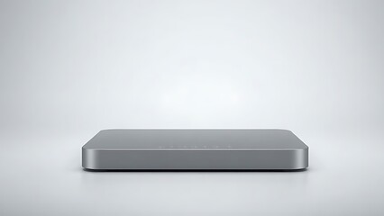 Sleek rectangular device with glossy finish on a gradient backdrop, exemplifying minimalist technological aesthetics.