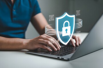 Person using laptop with digital shield and lock cybersecurity concept