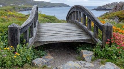 Rustic wooden bridge over a coastal path.  A weathered, arched bridge spans a gravel path,  leading to a tranquil view of the ocean.  Colorful wildflowers and lush greenery surround the structure. 