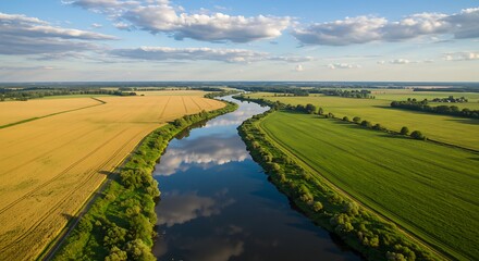 Serene River Winding Through Golden Fields and Lush Green Meadows
