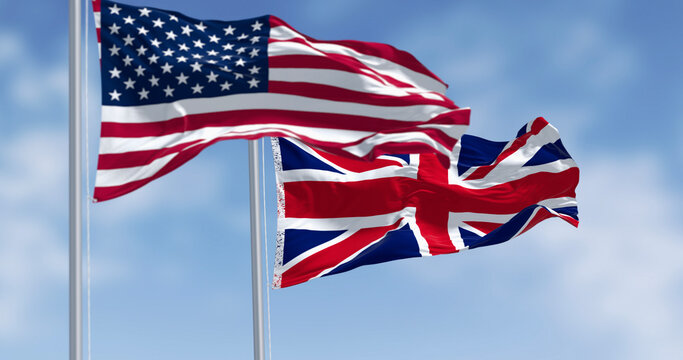 National flags of the Unites States and United Kingdom waving in the wind