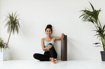Fitness And Sport Concept. Beautiful Young Woman With Yoga Mat Relaxing On Floor Near White Wall In...