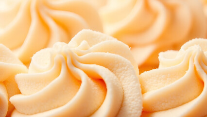 Close-up of creamy, swirled frosting, perfect for cakes and desserts.